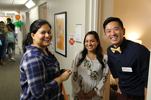 counseling staff greeting visitors during open house