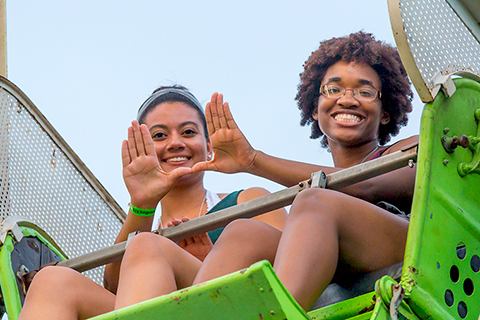 Students riding Ferris Wheel at Canes Carnival